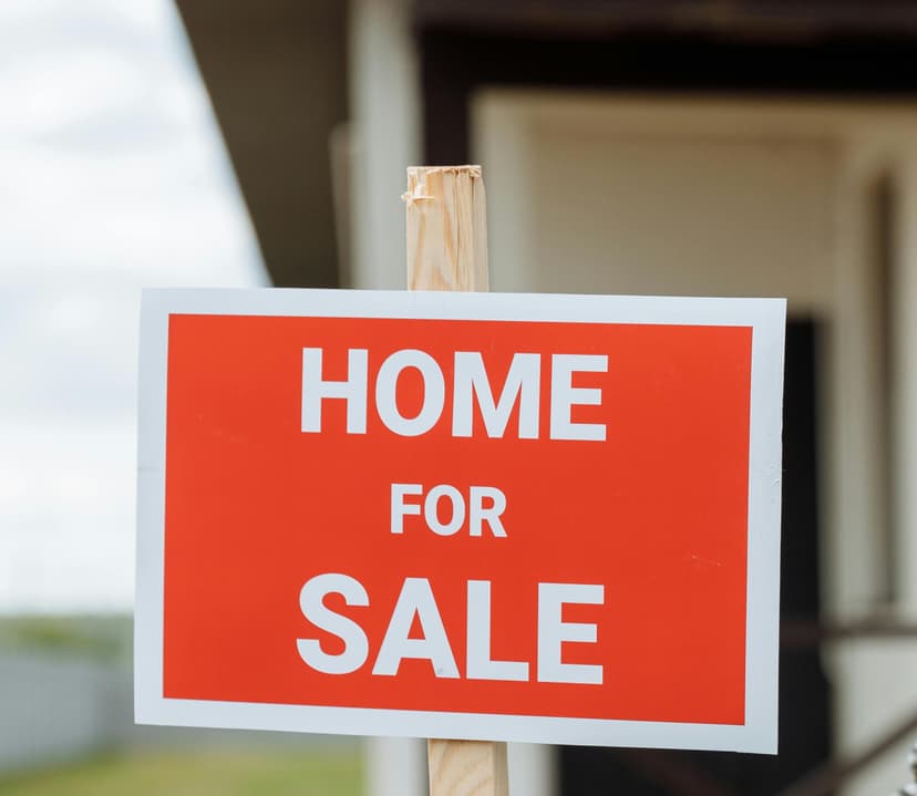 For sale sign and property